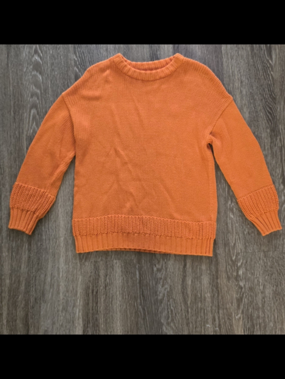 features an orange, crew-neck sweater with distinctive wide-ribbed Zara 134cm